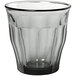 A clear Duralex glass tumbler with a black rim.