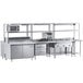 A stainless steel Chef's Counter preparation line in a large commercial kitchen.