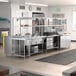 A kitchen with stainless steel appliances including Chef's Counter stainless steel serving line, steam table, and dish cabinets.