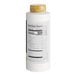 A white bottle of Capora White Chocolate Flavoring Sauce with a yellow label.