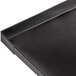 a black rectangular object with a corner