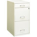 A white Hirsh Industries vertical file cabinet with three drawers and silver handles.