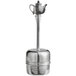 A Fox Run stainless steel tea infuser with a handle over a tea pot.
