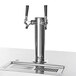 A stainless steel Beverage-Air beer tap with black handles on a counter.