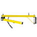 A yellow metal TPI Fostoria 3-arm loading dock light.