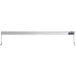 A white rectangular metal shelf with a long white rectangular object attached to it.