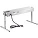 A silver rectangular ServIt strip warmer with a cord.