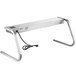 A silver rectangular ServIt strip warmer with a power cord on a table.