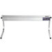 A stainless steel ServIt strip warmer on a white table with "C" style legs.