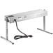 A silver rectangular ServIt strip warmer with a black power cord.