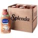 A brown container of Splenda Sugar-Free Hazelnut Coffee Creamer next to a brown Splenda box.