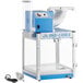 A blue and white Carnival King snow cone machine with a metal scoop and black plug.