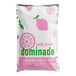 A white bag of DominAde pink lemon drink mix with pink and green text.