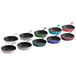 A row of Valor merlot enameled mini cast iron skillets in different colors.