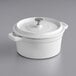 A Valor Arctic White enameled cast iron pot with a lid.