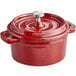 A red Valor mini cast iron pot with a lid.