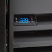 A Beverage-Air kegerator with a digital display on a black surface.