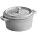 A slate grey Valor enameled cast iron pot with a lid.