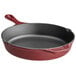 A red Valor enameled cast iron skillet with a helper handle.