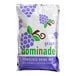 A white DominAde package with purple and green grape design.