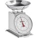 A silver Galaxy mechanical portion scale with a stainless steel bowl on it.