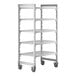 A white metal Cambro Camshelving® Premium mobile shelving unit with shelves.
