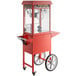 A red Carnival King popcorn machine with wheels.
