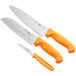 A group of three Choice knives with neon orange handles.