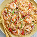 a plate of food with shrimp and rice