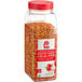 A jar of Lawry's Roasted Garlic and Red Bell Pepper seasoning with red and white seasoning inside.
