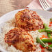 A plate of rice, asparagus, and chicken seasoned with Lawry's Roasted Garlic and Red Bell Pepper seasoning.