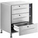 A stainless steel ServIt triple drawer warmer on a counter.