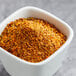 A white bowl with a mixture of Lawry's Sweet Basil, Citrus, and Garlic Rub spices.