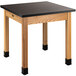 A National Public Seating science lab table with black legs and a black phenolic top.