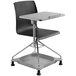 A close up of a black and gray National Public Seating Glide for Go Series Mobile Tablet Chair.