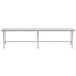 An Advance Tabco stainless steel work table with an open base and metal legs.