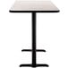 A rectangular black cafe table with a black base.