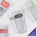 A group of empty clear GET Bahama plastic tumblers.
