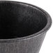 A close up of a black polyethylene ramekin.