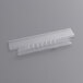 A close-up of a Pendaflex clear plastic insertable tab strip with a small hole.