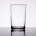 A close-up of a Libbey straight sided clear glass on a table.