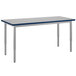 A long rectangular table with a gray top and silver legs.