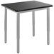 A black National Public Seating utility table with a metal base and legs.