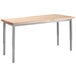 A National Public Seating utility table with a wooden top and gray metal legs.