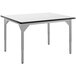 A white National Public Seating utility table with a black edge and legs and a whiteboard top.