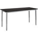 A gray National Public Seating utility table with a black rectangular top and silver legs.