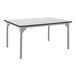 A rectangular table with a white top and black legs.