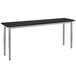 A National Public Seating gray rectangular utility table with legs and a black top.