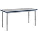 A National Public Seating adjustable height utility table with a gray laminate top and silver legs.