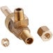 A close-up of a brass ServIt valve with two nuts.